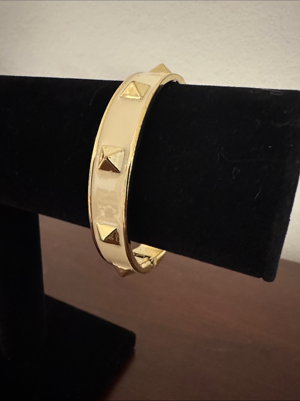 Coach Gold-Tone Pyramid Stud Cream Enamel Hinged Bangle